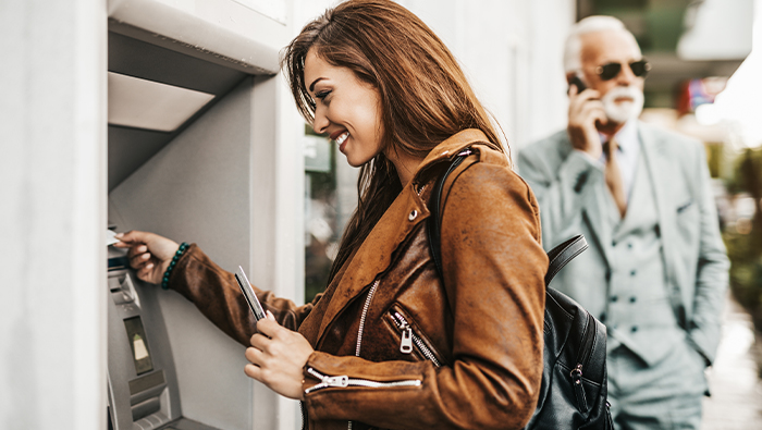 Woman using ATM