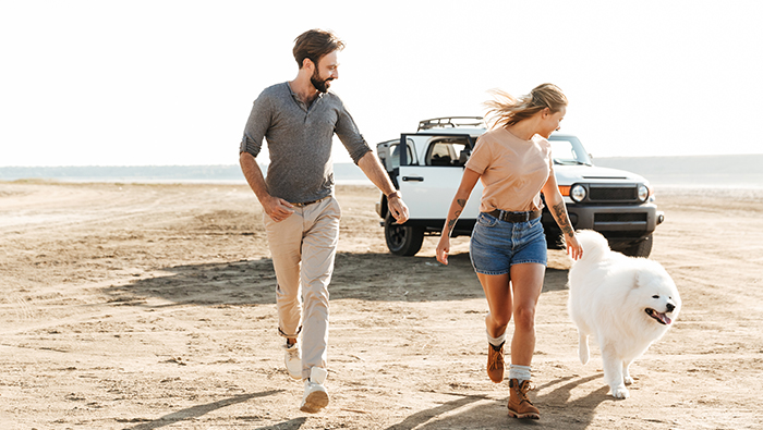 Couple and dog on beach