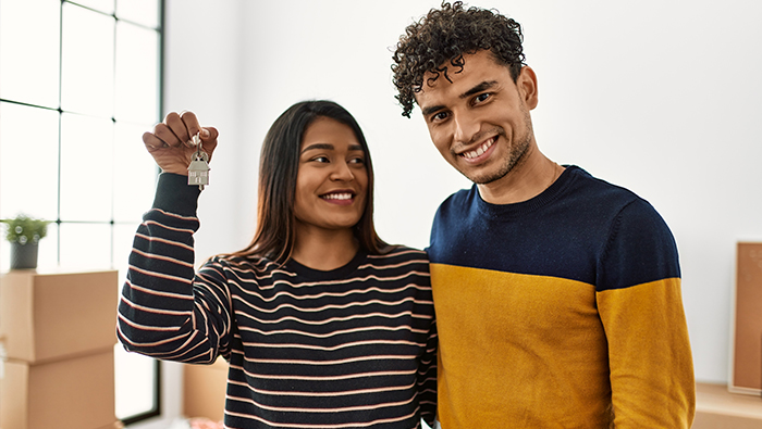 Couple with house keys