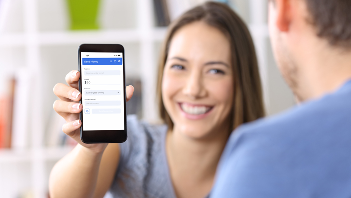 woman showing man phone screen