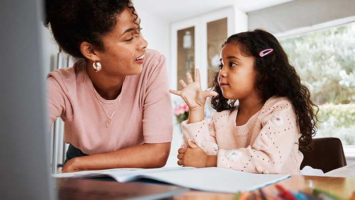 Mother daughter learning at computer