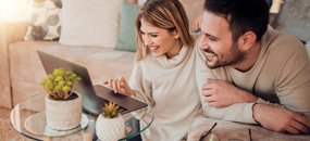 Couple looking at laptop